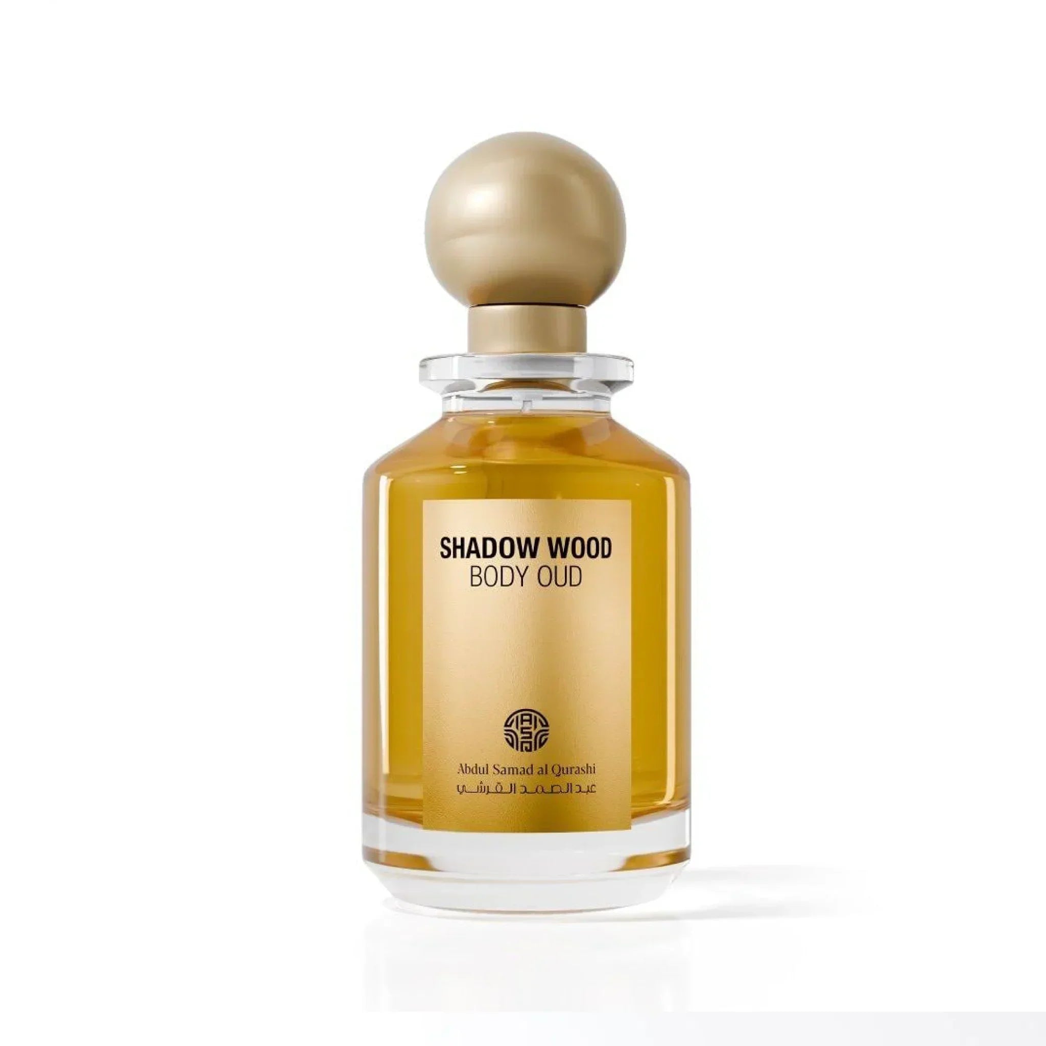 Shadow Wood Body Oud perfume bottle with gold cap and clear glass, luxury Middle Eastern fragrance