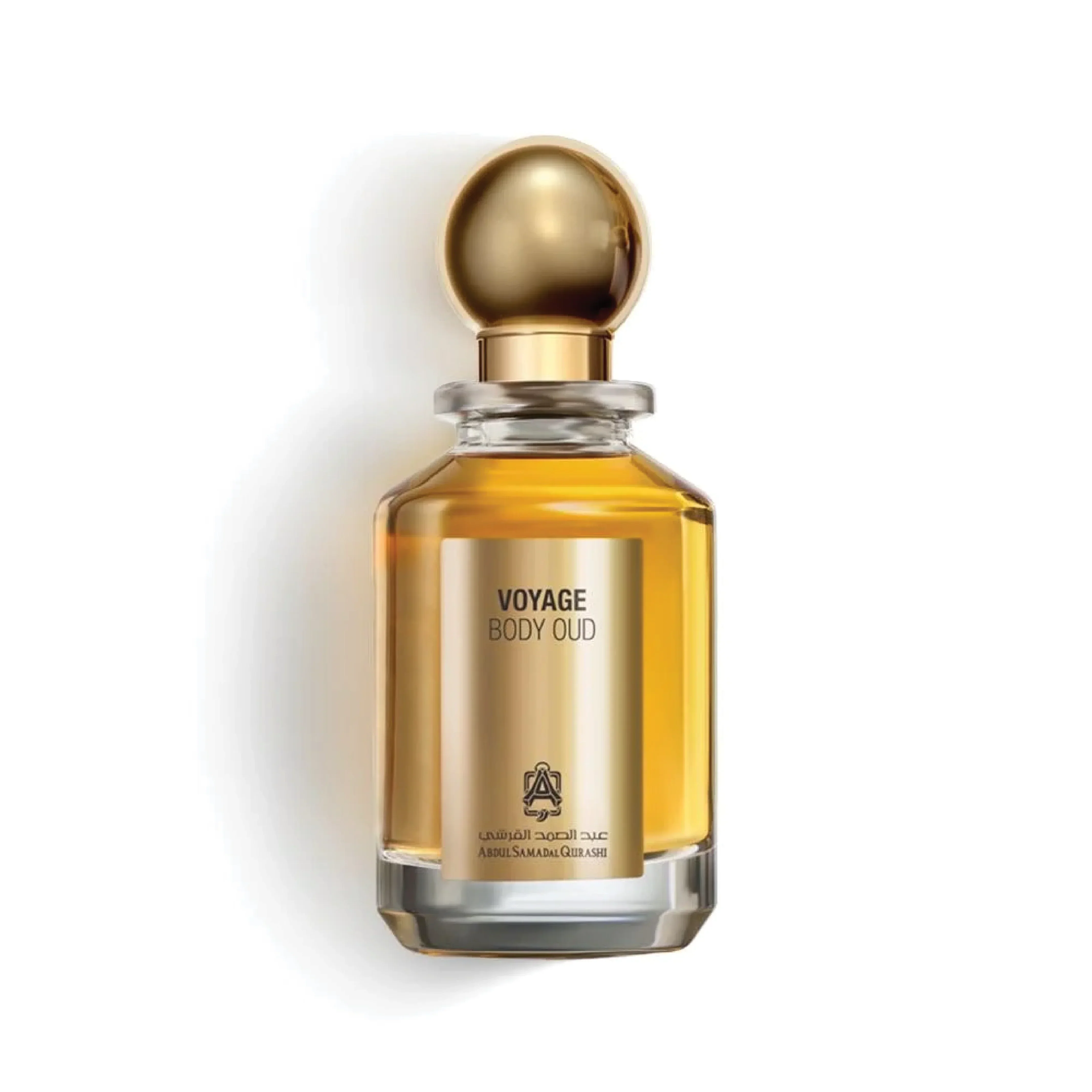 Gold bottle of VOYAGE BODY OUD perfume with rounded cap on a white background