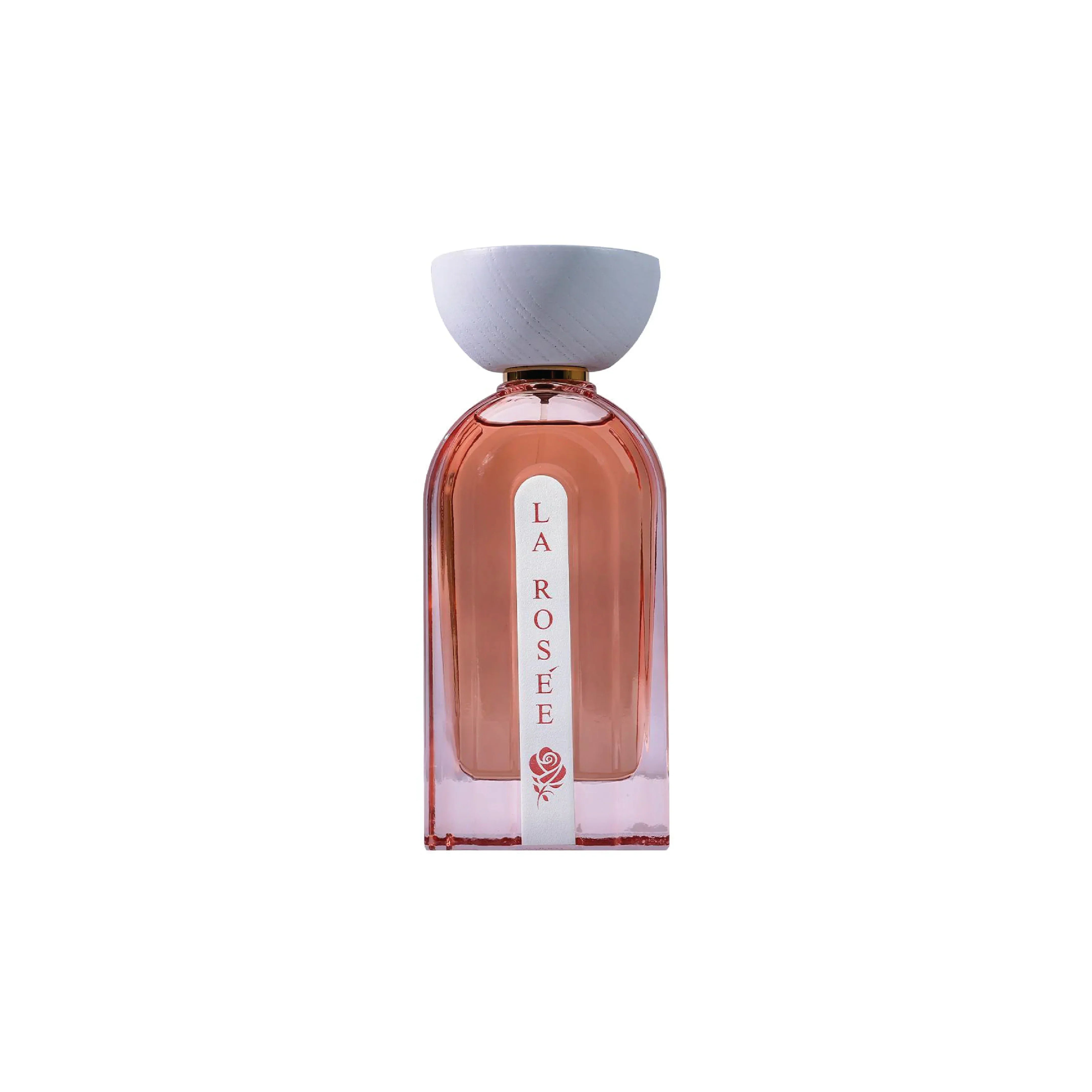 La Rosée luxury perfume bottle with pink hue and white cap on white background