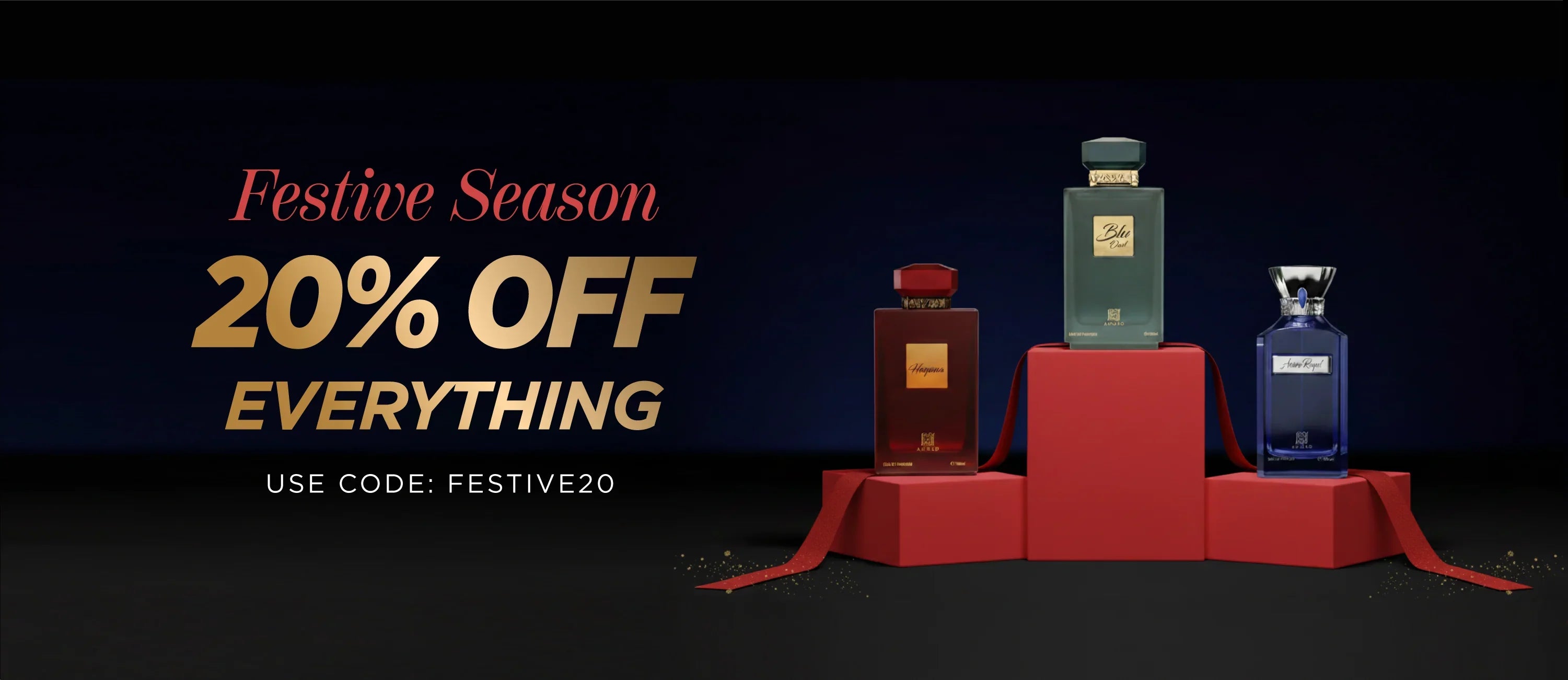 Luxury perfumes on red pedestals with festive 20% off promotion for holiday season