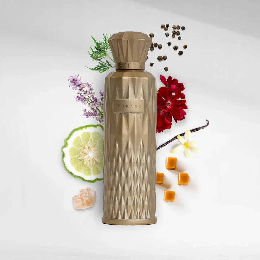 Gold perfume bottle with geometric design, surrounded by citrus, vanilla, caramel, flowers, and peppercorns