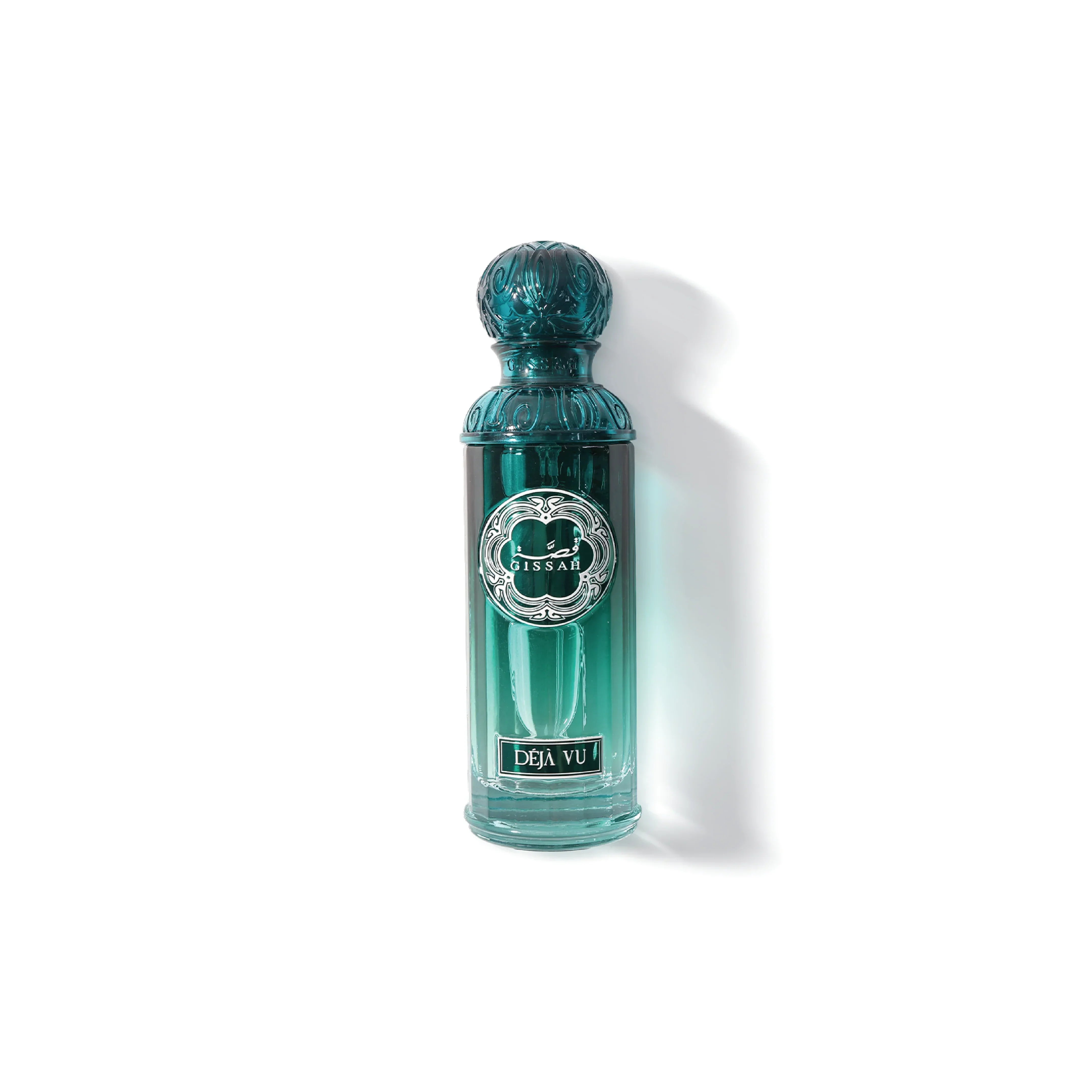 Elegant green Gissah Déjà Vu perfume bottle with ornate cap on white background