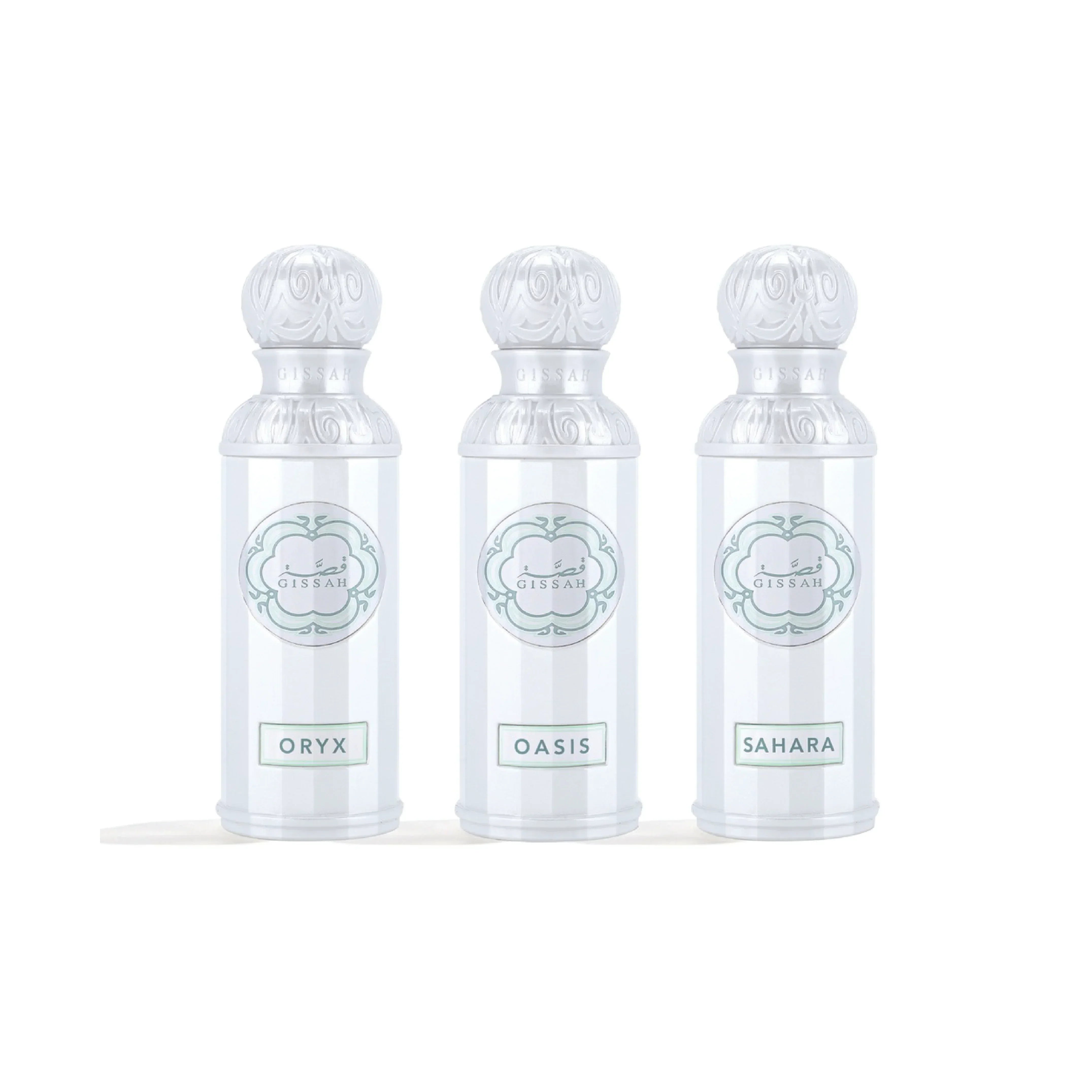 Three elegant white perfume bottles labeled Oryx, Oasis, Sahara with ornate caps