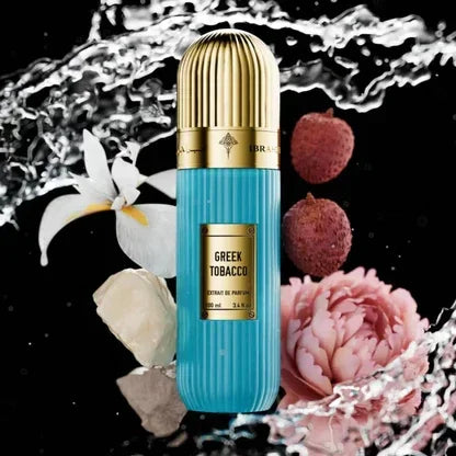 Greek Tobacco perfume bottle with gold cap, surrounded by white orchid, lychee, rose, and water splash