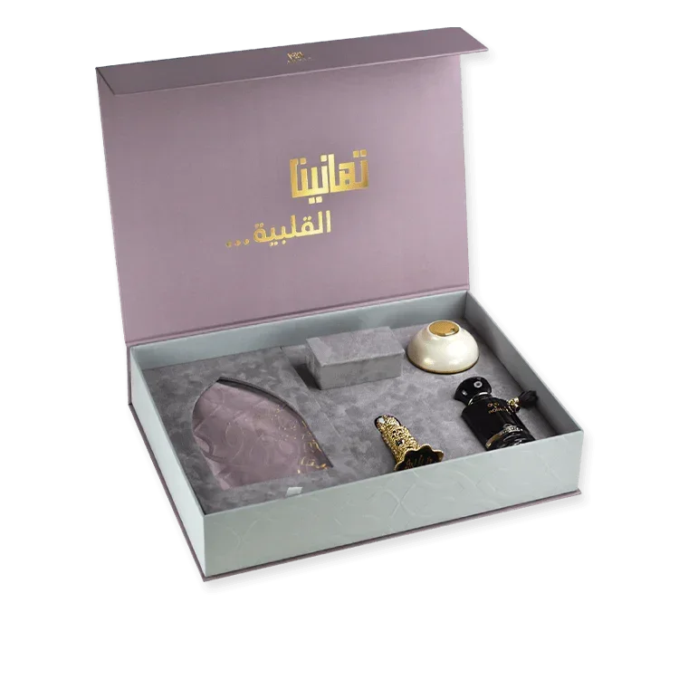 Elegant Middle Eastern fragrance gift set with ornate perfume bottles in a luxurious box.