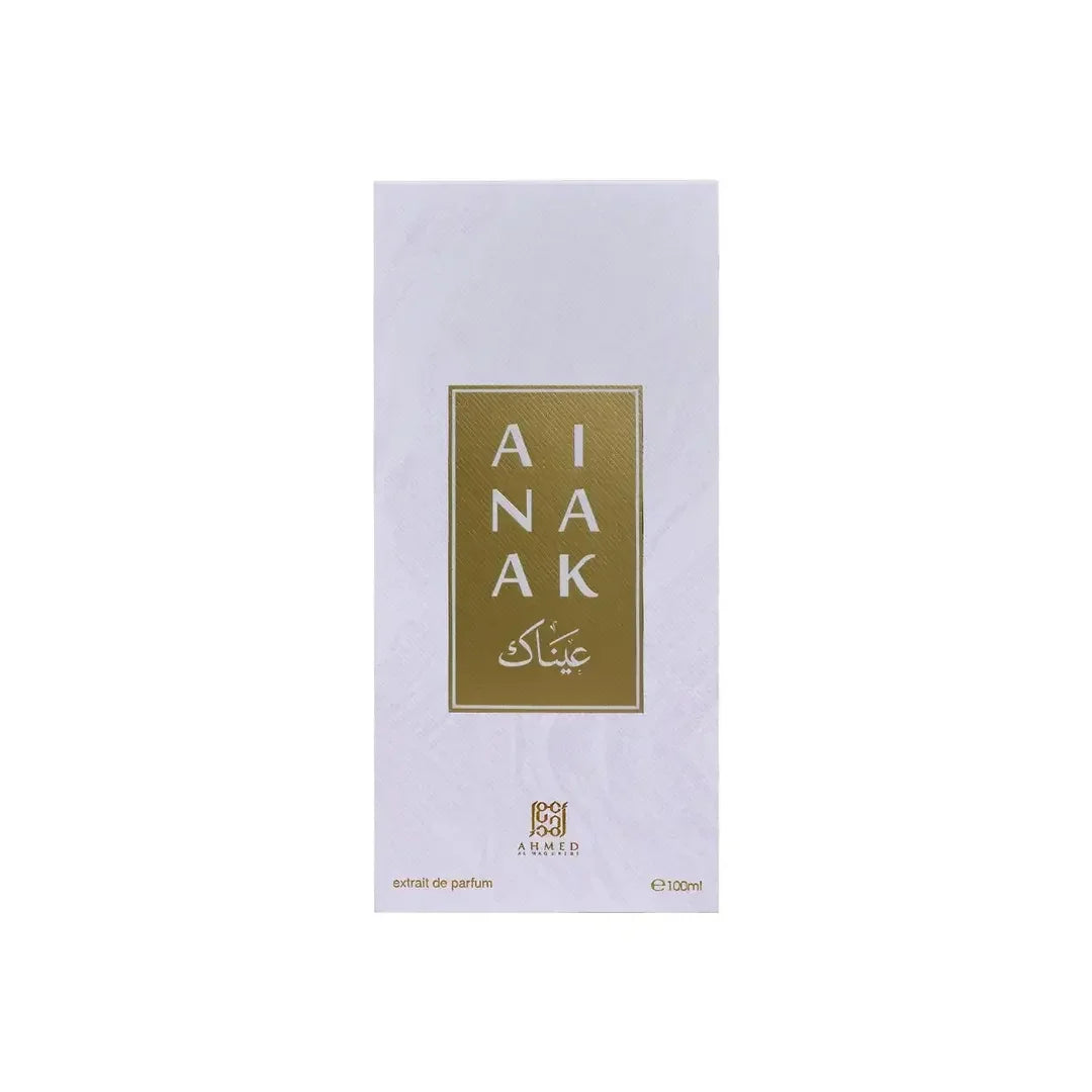 AINAAK perfume box in white with gold label and Arabic text, luxury fragrance packaging