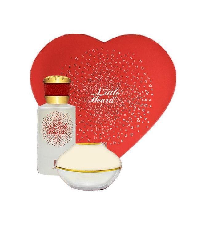 Luxury perfume gift set with heart-shaped red box, bottle, and jar labeled Little Hearts
