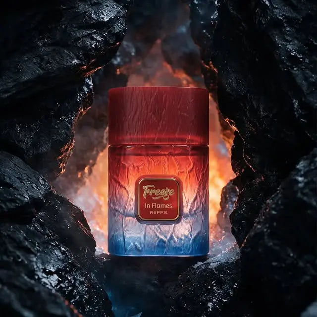 Riiffs Freeze in Flames 100ml perfume bottle with a red-to-blue gradient glass design, set against a dark, glowing rocky backdrop.