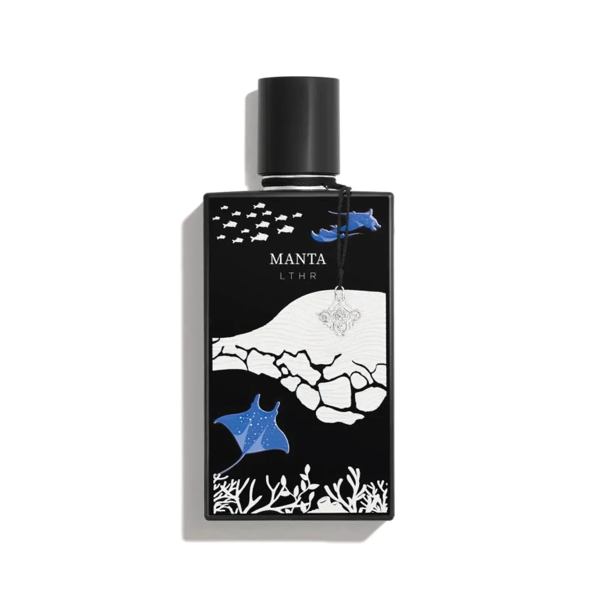 Luxury perfume bottle with MANTA LTHR label and ocean-inspired design featuring mantas and coral.