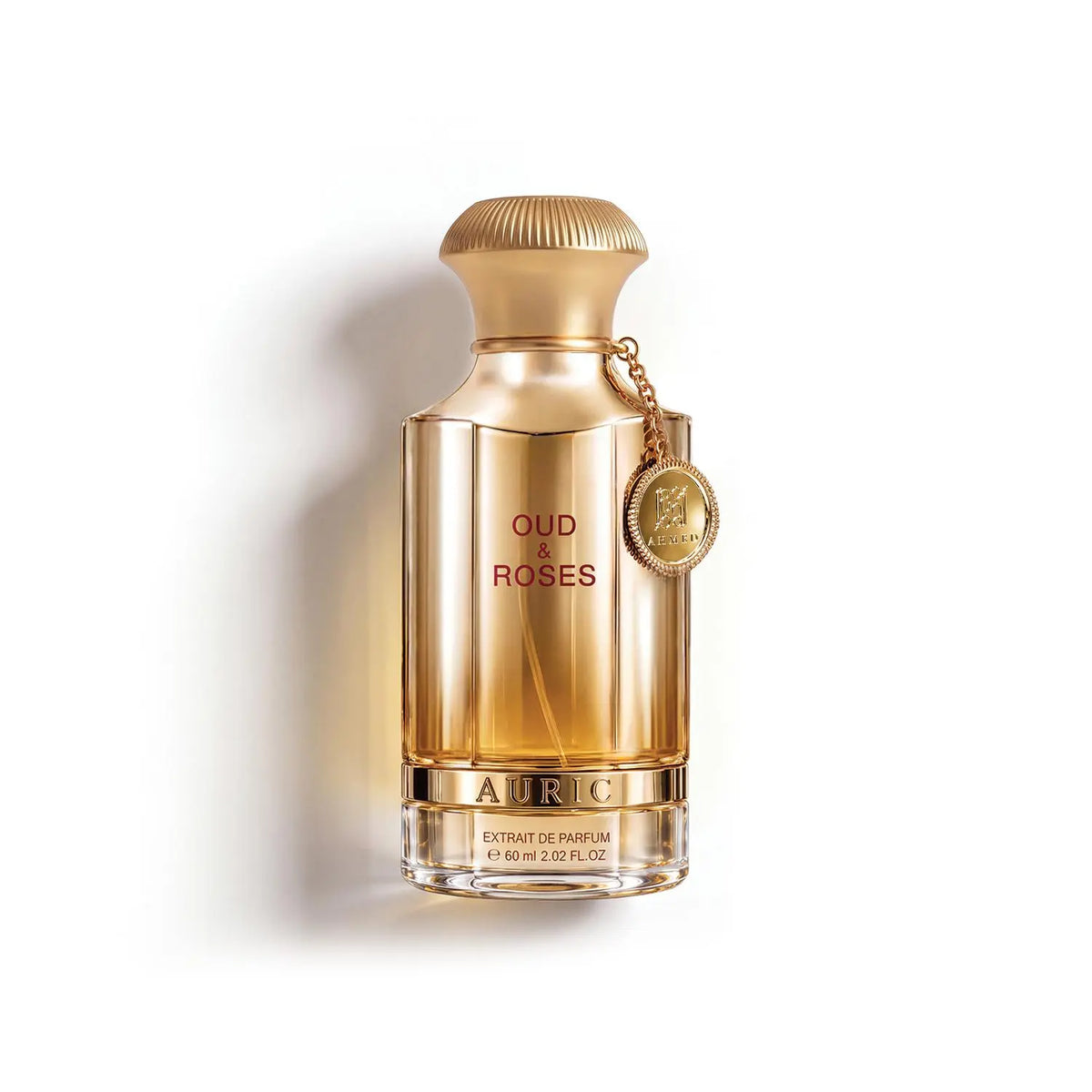 Gold 60ml Oud & Roses Auric perfume bottle with a metallic finish, ribbed cap, and branded hanging charm.
